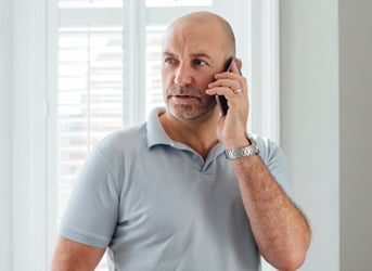 man speaking on a mobile phone